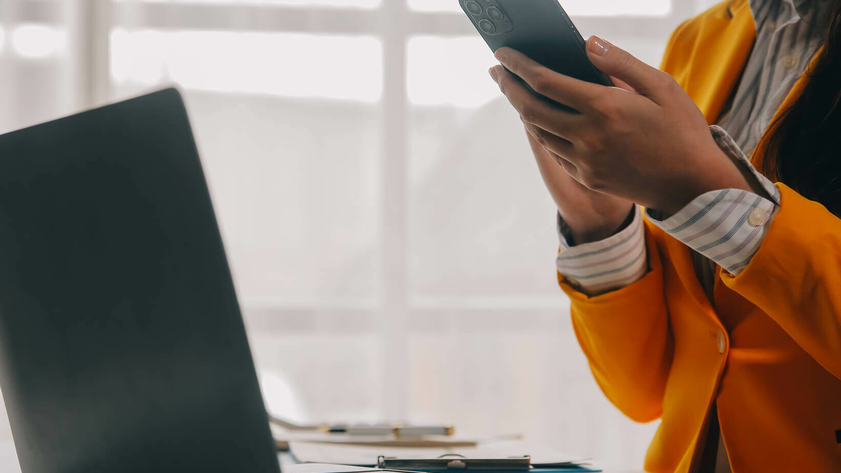 woman holding a smart phone