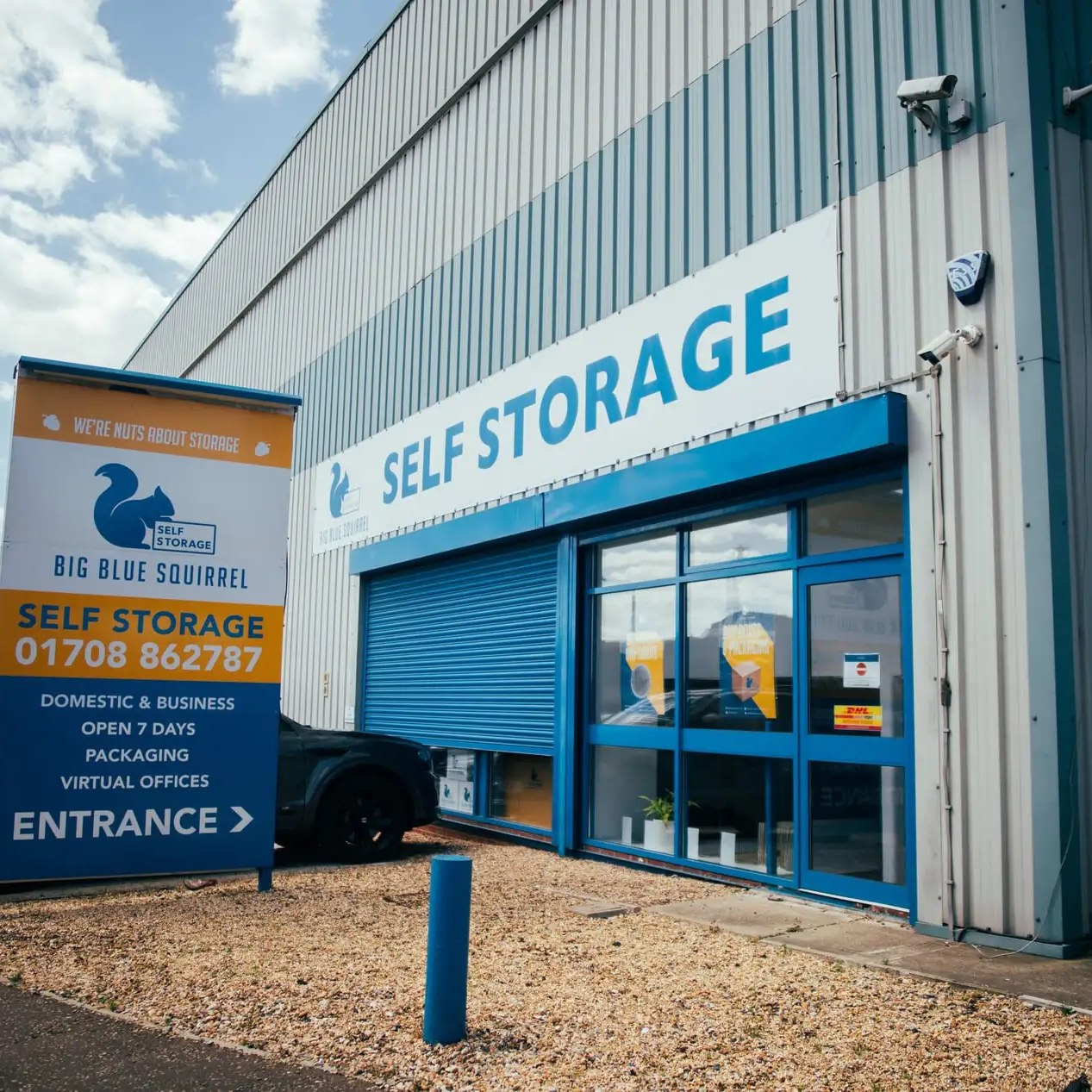 Exterior view of a Blue Squirrel Self Storage facility with a bold 
