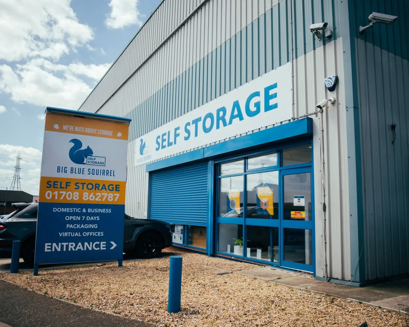 Exterior view of a Blue Squirrel Self Storage facility with a bold 