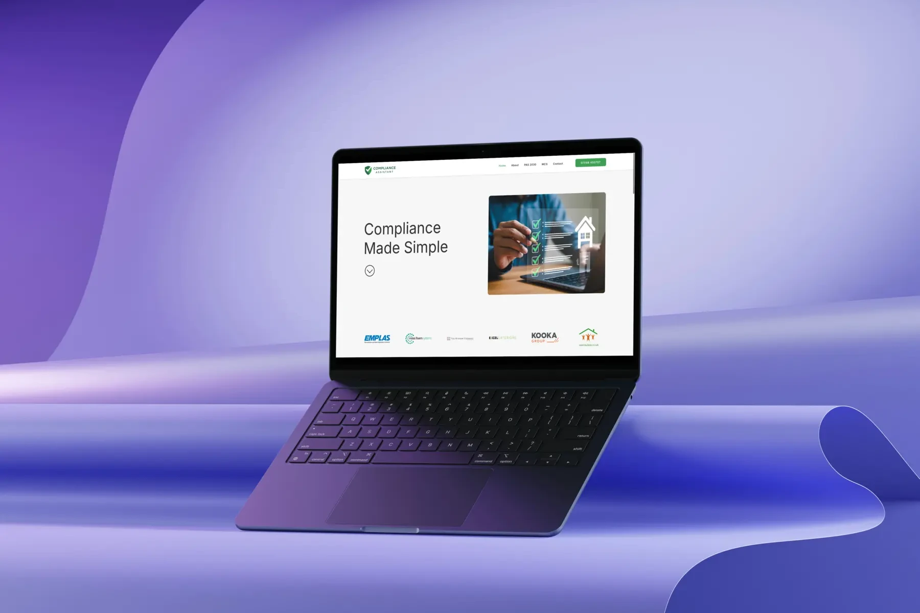 A laptop displaying a website with the headline